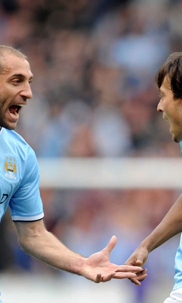 Ten-man Manchester City battle past Hull to forget Barca woes